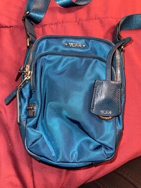 Tumi Ruma Navy Crossbody Bag with Gold Accent